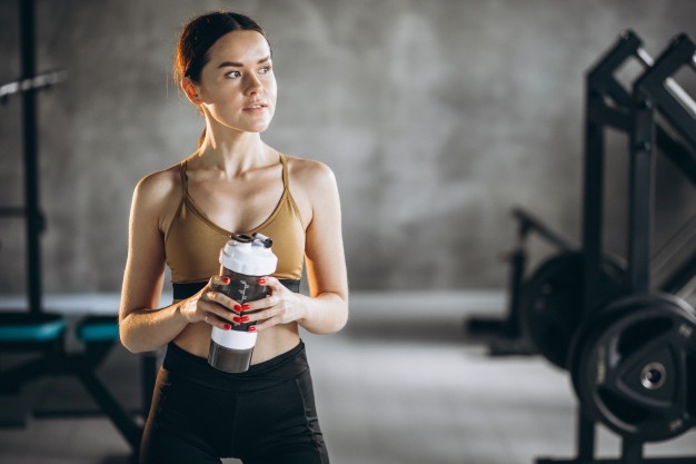 young-woman-drinking-water-after-workout